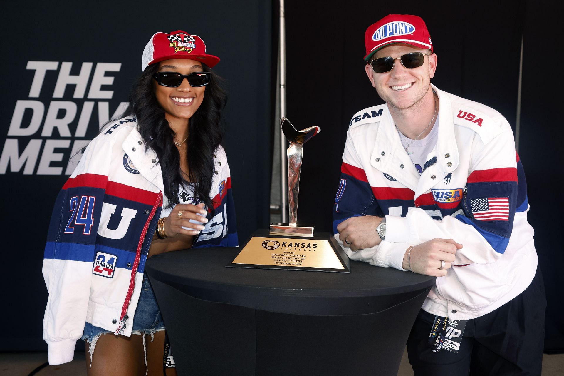 Tara Davis Woodhall and Hunter Woodhall at the NASCAR Cup Series Hollywood Casino 400 Presented by ESPN BET - Source: Getty